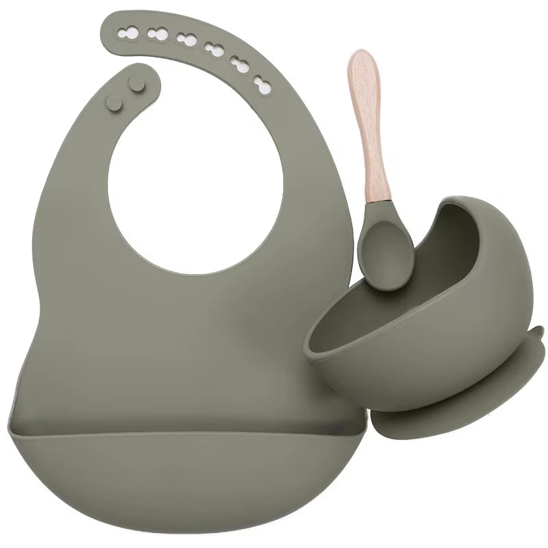 Complete feeding set with bib, bowl, and wooden spoon
