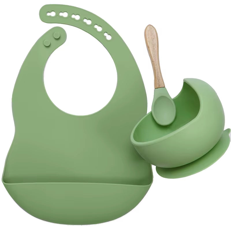 Complete feeding set with bib, bowl, and wooden spoon
