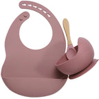 Complete feeding set with bib, bowl, and wooden spoon

