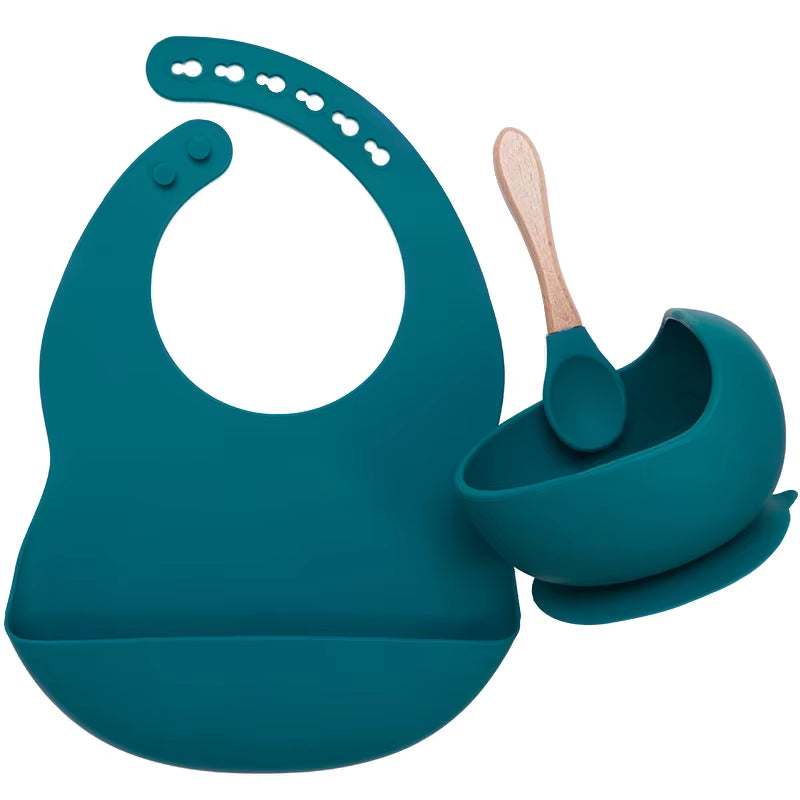 Complete feeding set with bib, bowl, and wooden spoon
